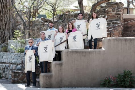 IAIA and Ojo Spa Resorts leadership displaying the “Cholla” shirt